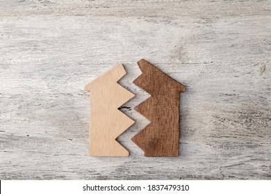 Broken House Modell On Wooden Background