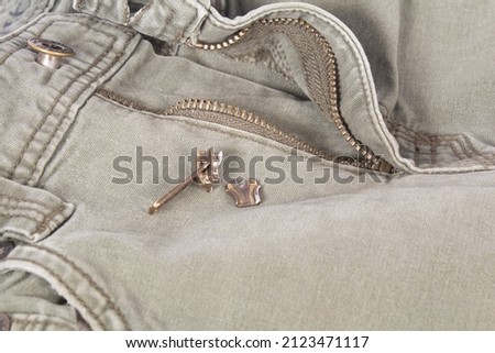 Broken Jean Pants Zipper Pull Waiting to be Repaired