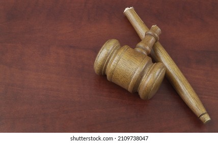 Broken judge gavel with copy space for text. Concept of lawlessness, injustice and not working laws. - Shutterstock ID 2109738047