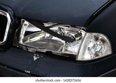 Broken Left Light On Dark Car.Totally Broken Left Light On A Dark Car.