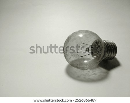 Broken light bulb isolated on white background as close-up with copy space