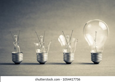Broken light bulb step to the perfect one, failure to success, improvement idea - Shutterstock ID 1054417736