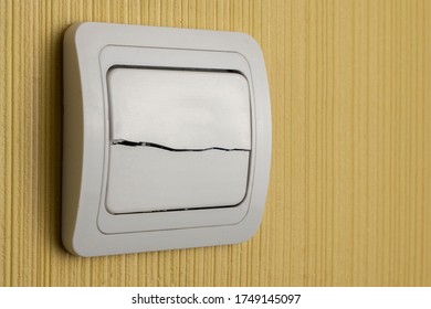 Broken Light Switch On A Room Wall