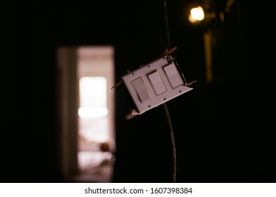 Broken lightswitch with one lightbulb lit