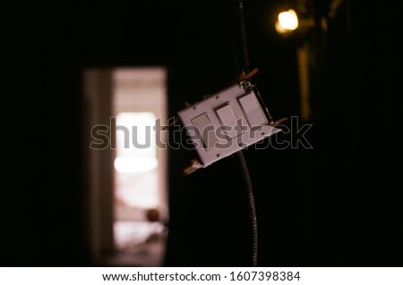Broken lightswitch with one lightbulb lit