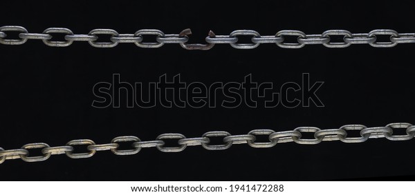 broken link
metal chain isolated on black
background