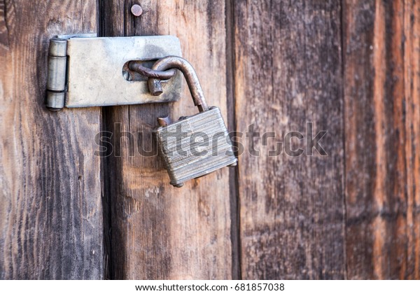 broken-lock-on-wooden-door-600w-681857038.jpg