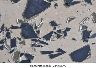 Broken Mirror Glass Shards Spread On The Floor