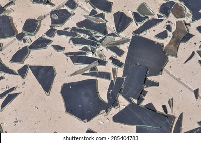 Broken Mirror Glass Shards Spread On The Floor