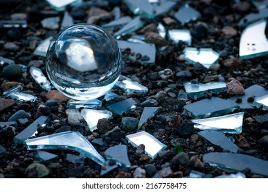 Broken Mirror Pieces With A Lens Ball