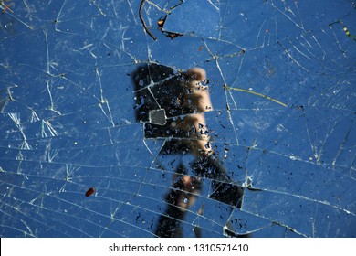 Broken Mirror. Broken Mirror With Sky And Camera Reflection. 7 Years Bad Luck.