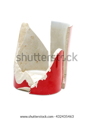 Broken mug in pieces.