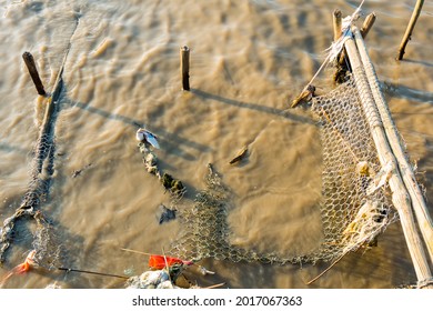 A Broken Net Used To Catch Fish Caught In Plastic Waste, A Sign Of Environmental Pollution That Could Have An Impact On Climate Change