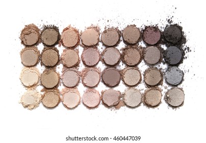 A Broken Neutral Colored Eye Shadow Make Up Palette Isolated On A White Background