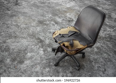 Broken Old Chair On Grey And Dirty Floor