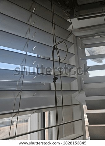Broken old fashioned windo blinds, the strings are broken