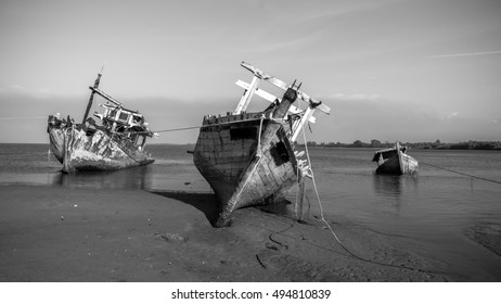 Broken and old fishing boat in black and white , Abandoned Ship at sabah borneo malaysia Image has grain or blurry or noise and soft focus when view at full resolution.