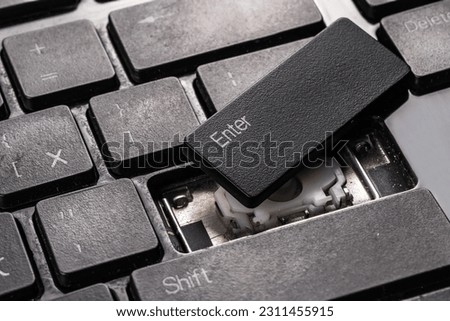 A broken old laptop keyboard close up.