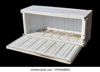 Broken Old Refrigerator In A Garbage Dump Isolated On  Black