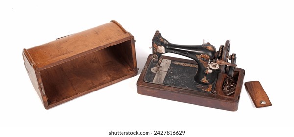 Broken old sewing machine, isolated on white background