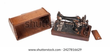 Broken old sewing machine, isolated on white background