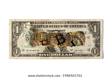 A broken one dollar bill over crypto currencies