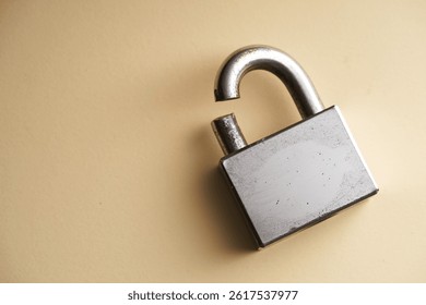 Broken padlock symbolizing compromised security.               
