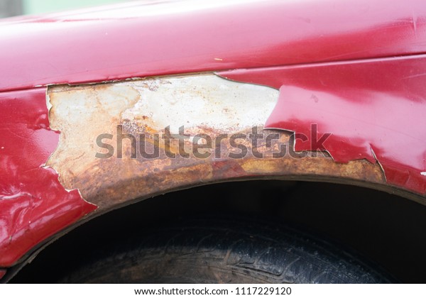 broken part of car body with rusty in old\
car.rust body car\
damage.