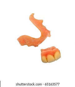 Broken Partial Upper Dentures Over White