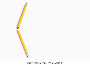 Broken pencil on white background close-up and free space for text. Graphite yellow pencil, broken in the middle, a manifestation of emotions, stress, aggression, problems in studies, problems at work - Powered by Shutterstock