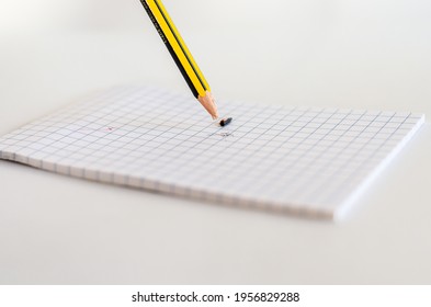 Broken Pencil Tip In White Notepad