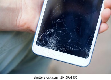 Broken Phone Screen In The Hands Of A Child