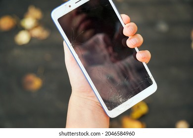 Broken Phone Screen In The Hands Of A Child