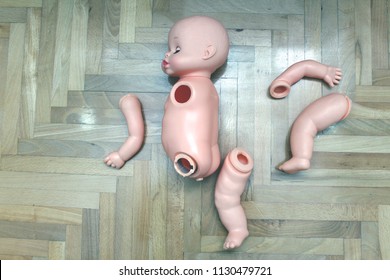 Broken Plastic Doll On The Floor