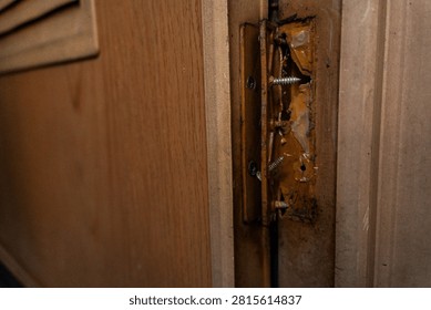 Broken plastic door hinge with severe damage, making it unsuitable for further use.