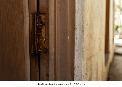 Broken plastic door hinge with severe damage, making it unsuitable for further use.