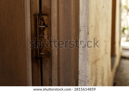 Broken plastic door hinge with severe damage, making it unsuitable for further use.