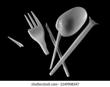 Broken Plastic White Fork And Spoon, Pieces Isolated On Black  