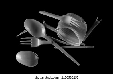 Broken Plastic White Fork And Spoon, Pieces Isolated On Black  