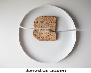 Broken plate of brown bread        
