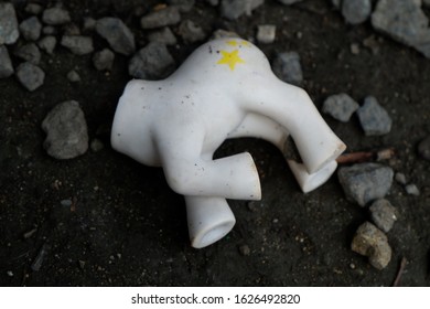 Broken Pony Toy Lying On The Ground