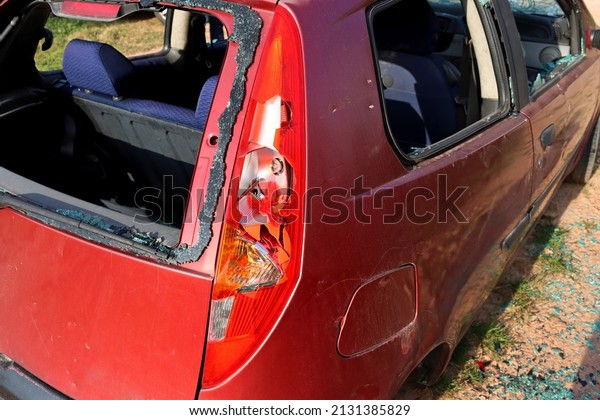 Broken rear headlight. A car with broken\
windows and headlights due to a car accident or careless driving.\
Insured event, safe driving\
concept\
