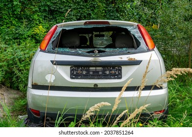 Broken Rear Window Of An Abandoned Car.