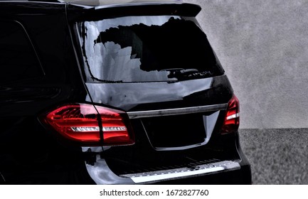 Broken Rear Window Of A Premium Black Car