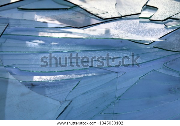 Broken rear\
windshield of a bus on the\
snow