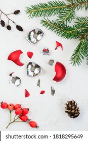 Broken Red Christmas Ball On A Light Background.