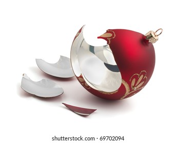 Broken red glass Christmas ball isolated on white