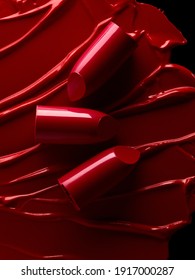 Broken red lipsticks over smudged lipstick background - Shutterstock ID 1917000287