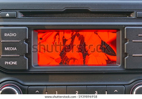 Broken red\
liquid crystal display in car dash\
board