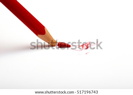 Broken red pencil.